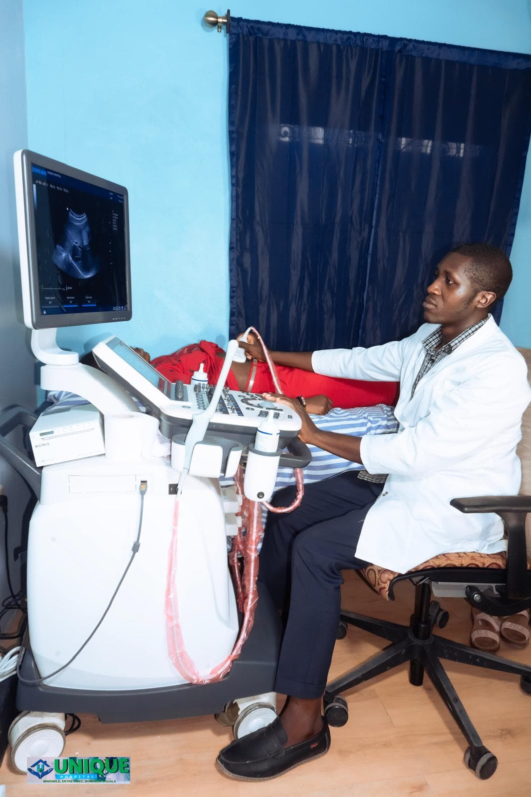 Student performing an ultrasound exam at Unique Hospital